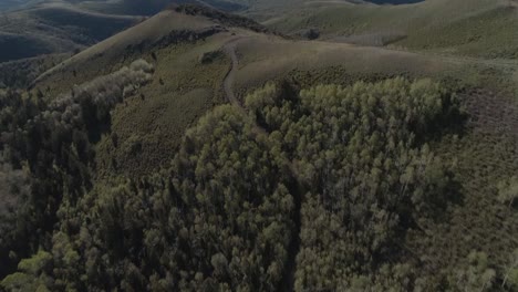 flyover shot while panning up revealing utah county and lake with wasatch mountain ranges in the background