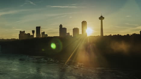 the sun shines through buildings on the canadian shore near niagara falls 1