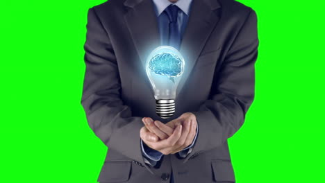 businessman presenting light bulb with hands