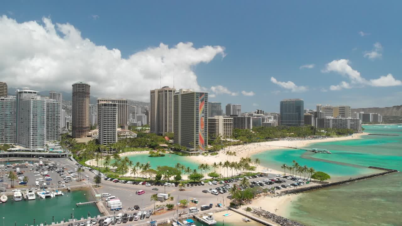 Version Two. Beautiful Aerial Orbit over Waikiki Beach, Honolulu, and Kahanamoku Beach with crystal clear ocean
