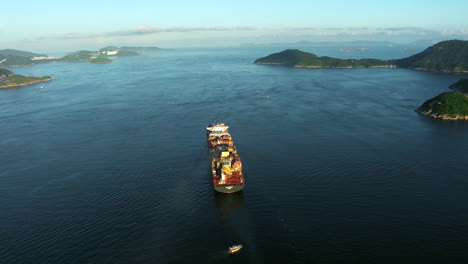 Container-ship-passing-through-an-archipelago