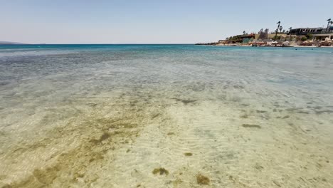 Blue-flag-beach-club-in-Izmir-Cesme-Alacati,-beach-umbrellas,-chairs,-beach-party-in