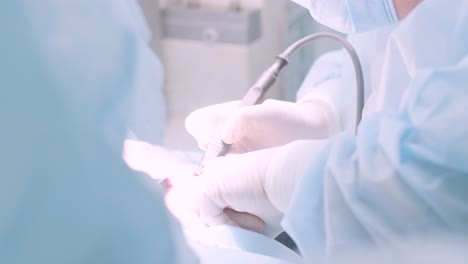 a surgeon in a sterile operating room performing a surgical procedure with focus and precision. represents healthcare, surgery, medical expertise, and patient care