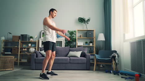 man doing stretching exercise at home
