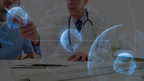Doctor discussing with patient, digital globe and data animation overlaying scene