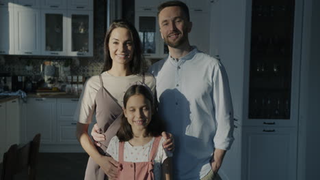 happy family portrait in kitchen