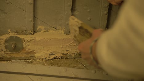 applying fillers restored wood rot inside wooden boat