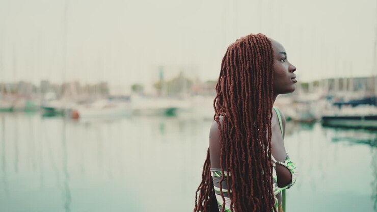 Woman with dreadlocks at the marina