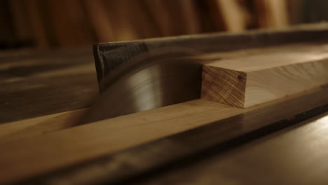 machine cutting plank into pieces