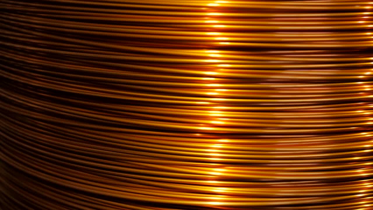 close-up of the rotation of the coil and wrap it copper wire. Manufacture of electric cable.