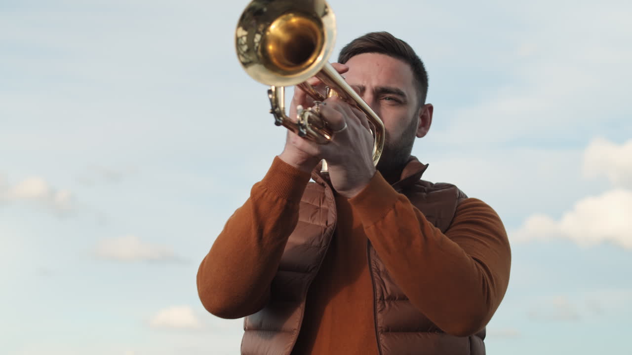 Man Playing Trumpet Outdoors