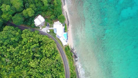 Bird’s-eye drone video over St. Croix reveals an exclusive beachfront home cradled by thick tropical forest, perched between the jungle and sea for maximum seclusion and stunning views