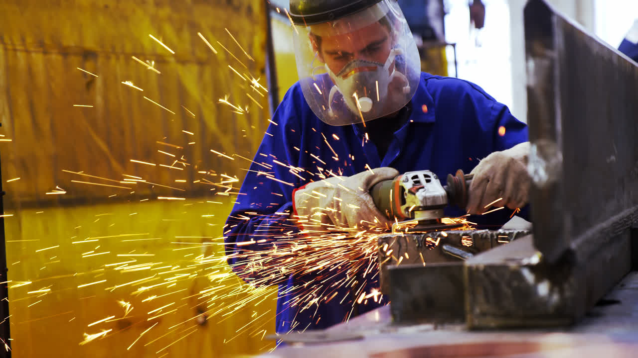 Male engineer using grinder machine 4k | Premium Stock Video Footage
