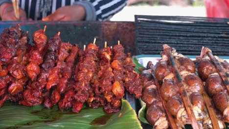 street food at the side of the road in banana leaves ready to be grilled