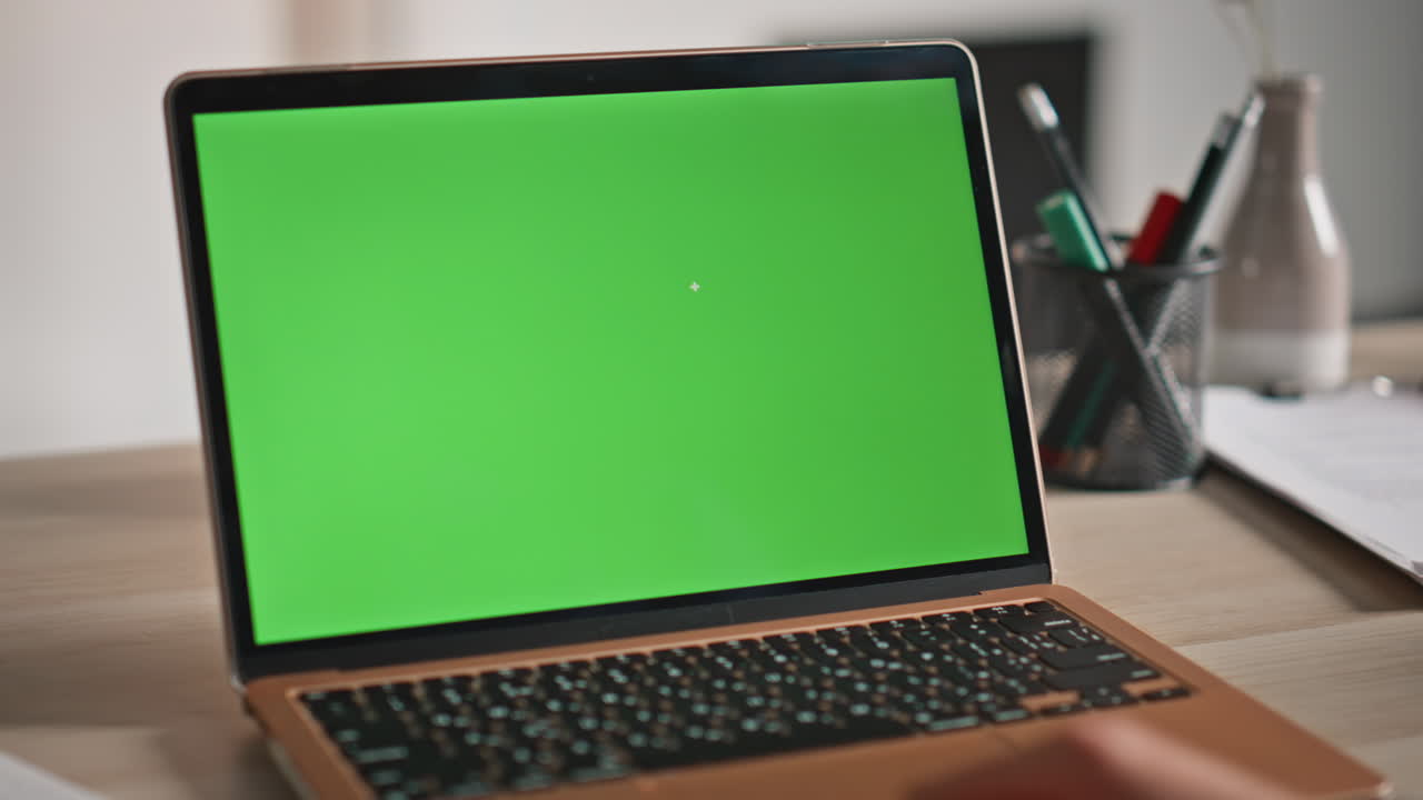 Businesswoman watching mockup laptop on workplace closeup. Unknown woman hand