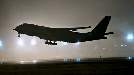 large cargo plane landing in fog at night