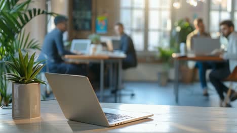 laptop on a wooden desk in a coworking space