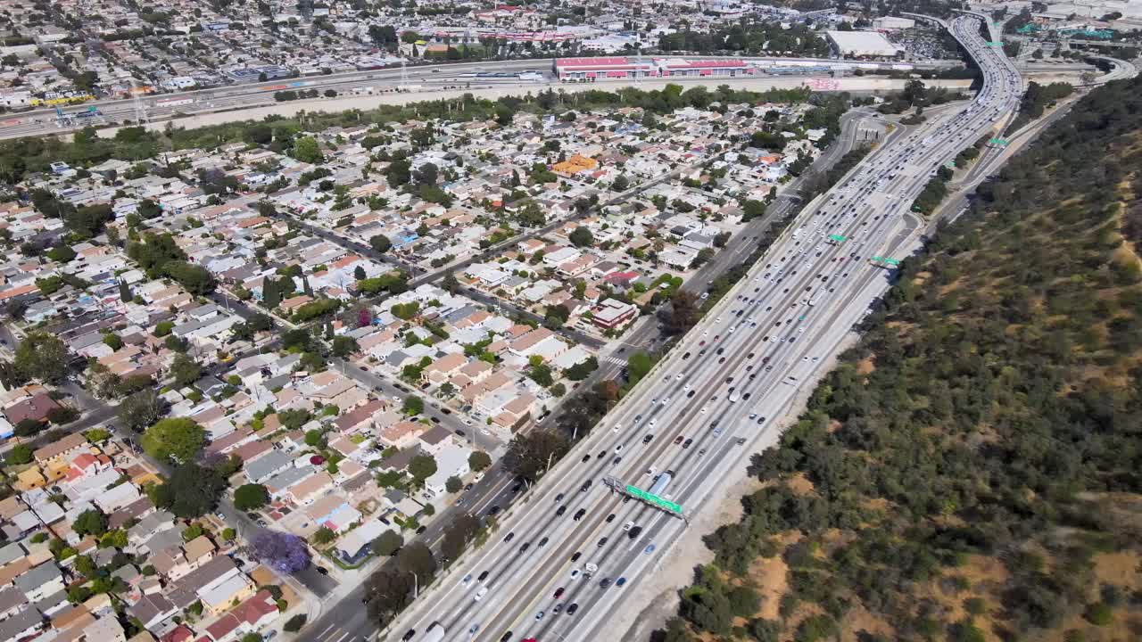 Drone footage offering a bird's-eye view over the bustling Highway 5 in Los Angeles and providing a unique perspective of the Elysian Valley neighborhood