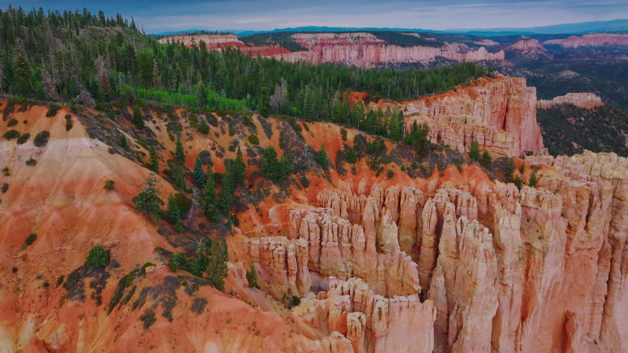 Breath-taking scenery of National Bryce Canyon Park in Utah, United States. Orange rocks and green pine trees from aerial view.