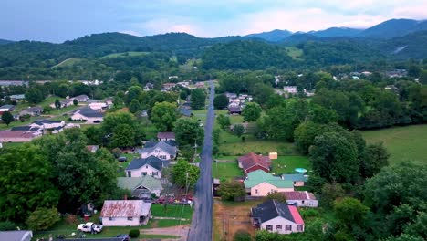 fast aerial push down roadway with homes in elizabethton tennessee