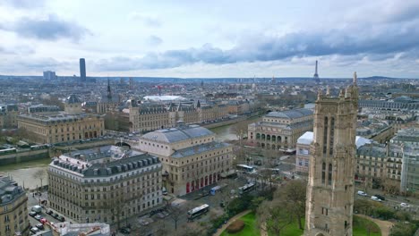 Saint-Jacques-Tower-and-square-near-Seine-river-with-Tour-Eiffel-in-background,-Boulevard-de-Sebastopol-at-Paris-in-France