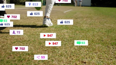 social media notifications animation over cricketers playing on grassy field