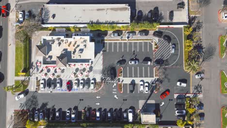 aerial view of a fast-food restaurant with drive-thru and parking lot