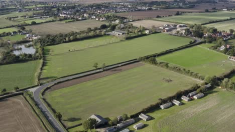 Fresh-green-farmland-and-buildings-on-a-summery-day-in-Essex-UK