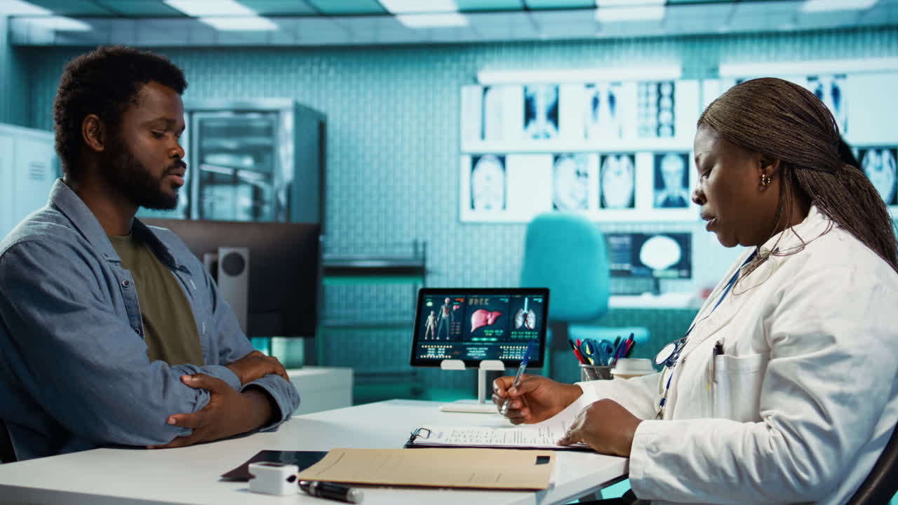 African american doctor and patient having in depth conversation about results