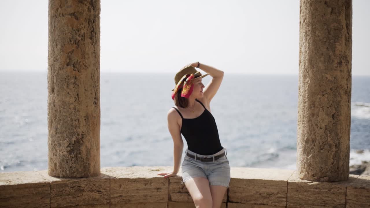 Attractive girl posing in front of priceless and stunning scenery of Costa Brava ,Catalonia