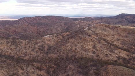 Spectacular-aerial-drone-footage-of-four-wheel-drive-vehicles-on-a-mountain-top