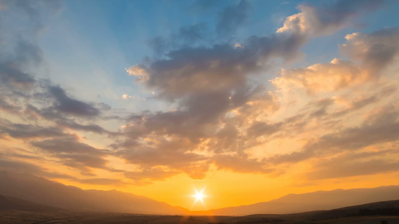 Time lapse of a yellow sunset with beautiful clouds.