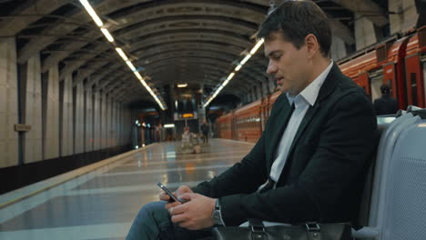 businessman waiting fot the tube train