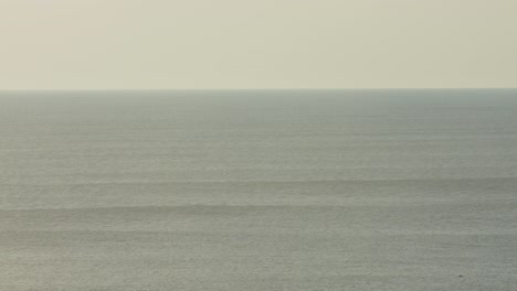 rolling waves along the portuguese coast in summer