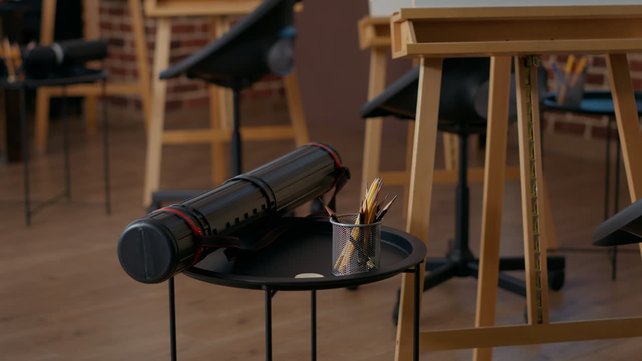 Empty art class with colorful pencils and artistic equipment on table