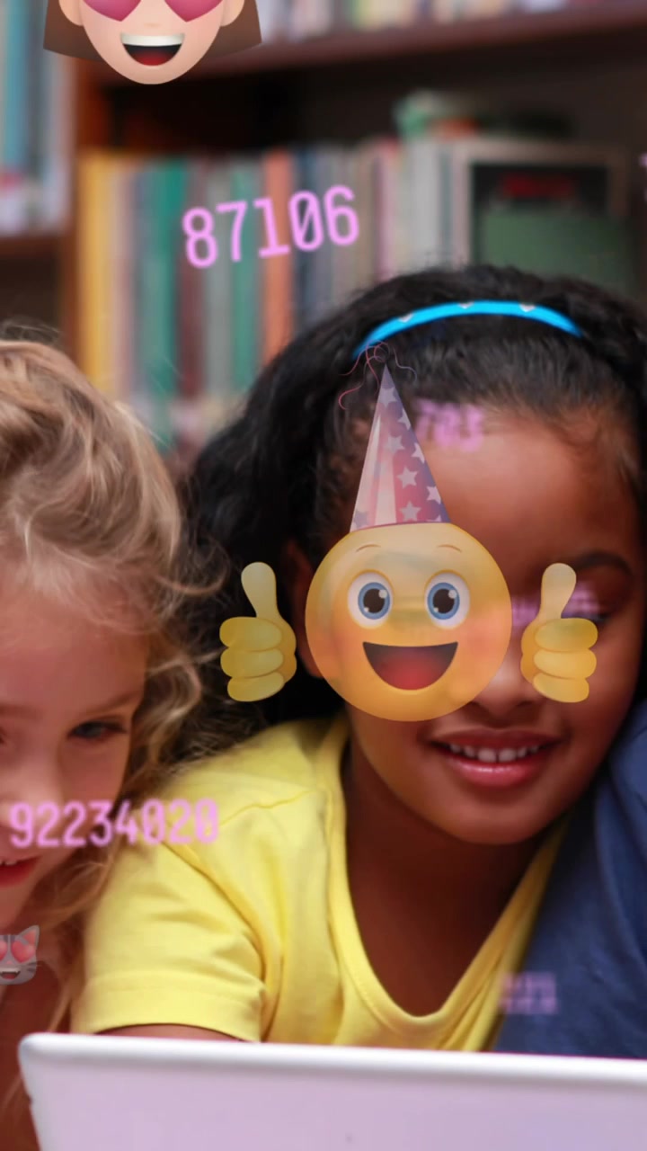Multiple changing numbers and face emojis floating against students using digital tablet at school