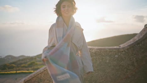 golden sunset backlit woman climbing stone stairs coastal landmark closeup.