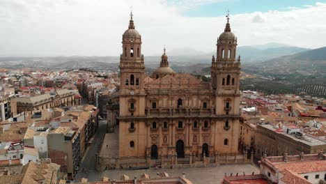 Spain-Jaen-Cathedral,-Catedral-de-Jaen,-flying-shoots-of-this-old-church-with-a-drone-at-4k-24fps-using-a-ND-filter-also-it-can-be-seen-the-old-town-of-Jaen