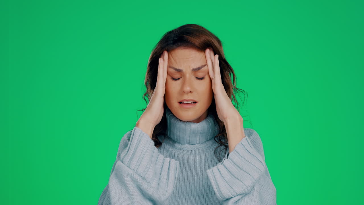 Woman, green screen or stress headache in studio