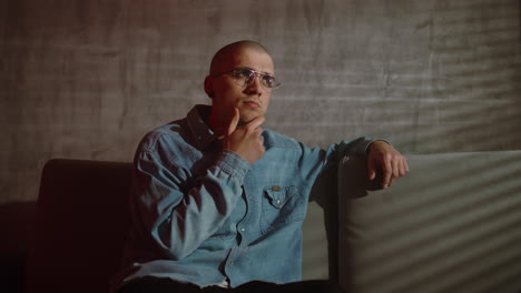 thoughtful man on a couch