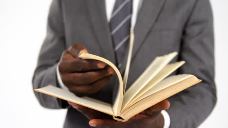 businessman flipping pages of a book