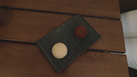 mochi dessert served with origami figure