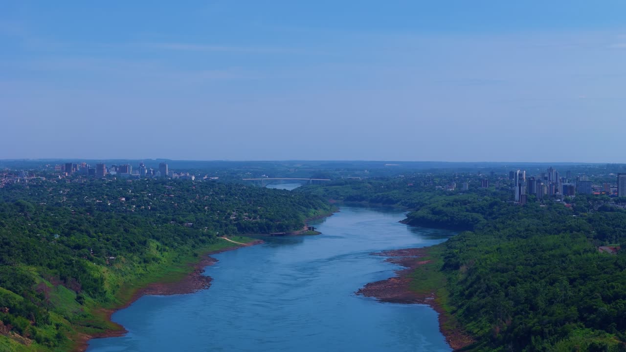 aerial view of the Paraná River with the Friendship Bridge in the background