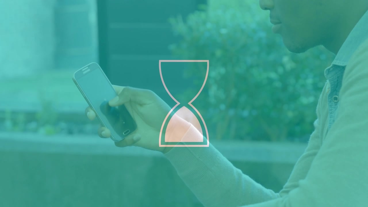 Touch pause starting hourglass overlay rotating and filling while man holding phone showing loading