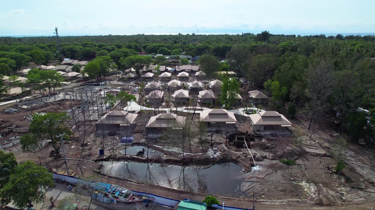 Construction of new tropical resort surrounded by nature, aerial