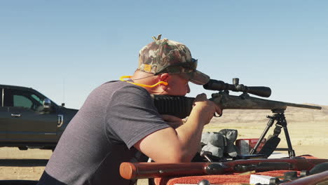 hunter man shoots r25 rifle with heavy recoil, slider shot, weapon gear