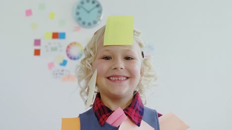 kid as business executive with sticky notes on his body 4k