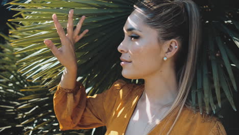 stylish young woman standing outdoors.