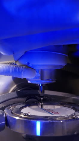 dental milling machine carving out shape. close up works of the dental milling machine processing of carving out shape of human teeth from dental milling machine