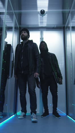 People Walking Through a Data Center